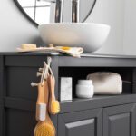 Modern freestanding bathroom cabinet in a bright and organized bathroom interior Photo title: Stylish freestanding bathroom cabinet