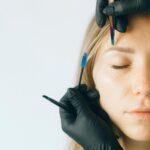 Close-up of natural-looking permanent eyebrows on a female face, showing precise shape and color.